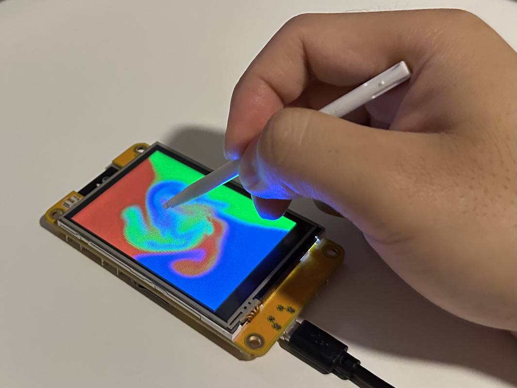 demo of ESP32-fluid-simulation, showing the colors of the screen being stirred by touch
